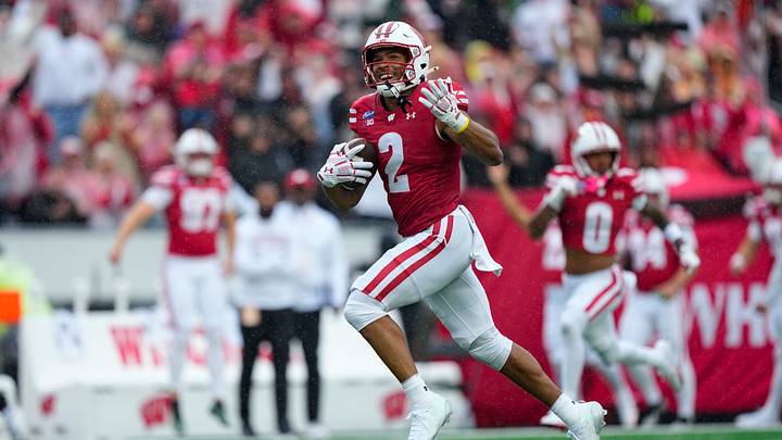 Sep 19, 2026; Madison, Wisconsin, USA;  Wisconsin Badgers wide receiver Chris Brooks Jr. (2) rushes for a touchdown after catching a pass during the second quarter against the Eastern Michigan Eagles at Camp Randall Stadium. Mandatory Credit: Jeff Hanisch-Imagn Images