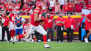Sep 15, 2024; Kansas City, Missouri, USA; Kansas City Chiefs tight end Travis Kelce (87) runs the ball against the Cincinnati Bengals during the game at GEHA Field at Arrowhead Stadium. Mandatory Credit: Denny Medley-Imagn Images
