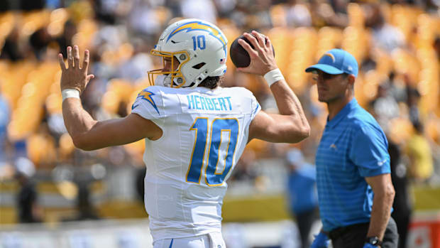 Sep 22, 2024; Pittsburgh, Pennsylvania, USA; Los Angeles Chargers quarterback Justin Herbert (10) works out as head coach Jim