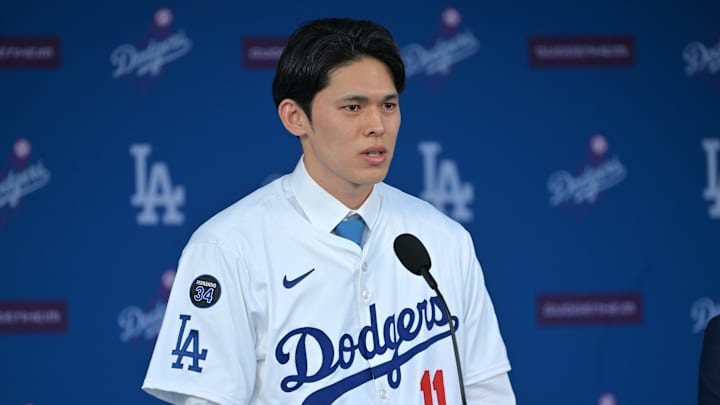 Los Angeles Dodgers pitcher Roki Sasaki speaks during an introductory press conference at Dodger Stadium. Los Angeles Dodgers pitcher Roki Sasaki speaks during an introductory press conference at Dodger Stadium.