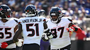 Oct 5, 2025; Baltimore, Maryland, USA; Houston Texans defensive tackle Mario Edwards (97) celebrates a sack with defensive end Will Anderson Jr. (51) and defensive end Danielle Hunter (55) during the second quarter at M&T Bank Stadium. Mandatory Credit: Rafael Suanes-Imagn Images