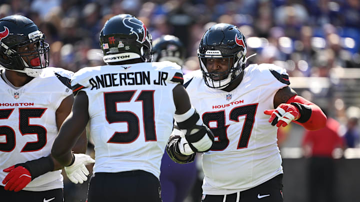 Oct 5, 2025; Baltimore, Maryland, USA; Houston Texans defensive tackle Mario Edwards (97) celebrates a sack with defensive end Will Anderson Jr. (51) and defensive end Danielle Hunter (55) during the second quarter at M&T Bank Stadium. Mandatory Credit: Rafael Suanes-Imagn Images