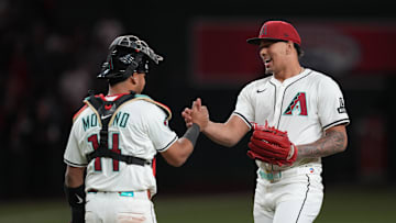 Apr 8, 2025; Phoenix, Arizona, USA; Arizona Diamondbacks pitcher Justin Martinez (63) and Arizona Diamondbacks catcher Gabriel Moreno (14) slap hands after defeating the Baltimore Orioles at Chase Field. Mandatory Credit: Joe Camporeale-Imagn Images
