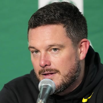 Nov 16, 2024; Madison, Wisconsin, USA;  Oregon Ducks head coach Dan Lanning talks to the media during the post game press conference following the game against the Wisconsin Badgers at Camp Randall Stadium. Mandatory Credit: Jeff Hanisch-Imagn Images