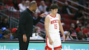 Oct 6, 2025; Houston, Texas, USA; Houston Rockets Head Coach Ime Udoka talks with guard Reed Sheppard (15) during the game against the Atlanta Hawks at Toyota Center. Mandatory Credit: Troy Taormina-Imagn Images