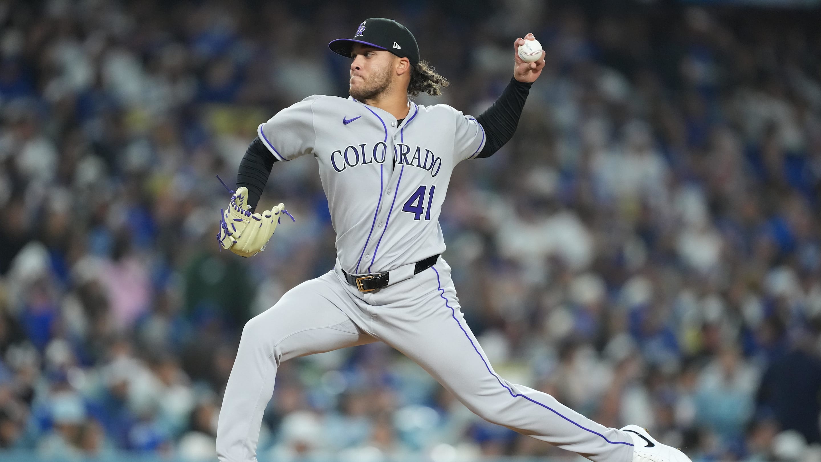 Apr 14, 2025; Los Angeles, California, USA; Colorado Rockies relief pitcher Luis Peralta (41) delivers a pitch in the bottom of the fifth inning against the Los Angeles Dodgers at Dodger Stadium. Mandatory Credit: Kirby Lee-Imagn Images