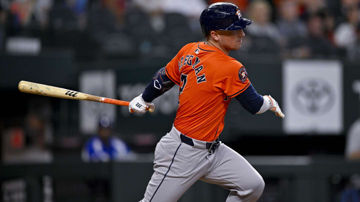 Aug 7, 2024; Arlington, Texas, USA; Houston Astros third baseman Alex Bregman (2) hits a single and drives in a run against the Texas Rangers during the eighth inning at Globe Life Field.