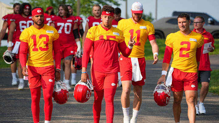 Jul 22, 2024; St. Joseph, MO, USA; Kansas City Chiefs quarterback Chris Oladokun (13) and quarterback Patrick Mahomes (15) and quarterback Carson Wentz (11) and quarterback Ian Book (2) walk down the hill from the locker room to the fields prior to training camp at Missouri Western State University. Mandatory Credit: Denny Medley-Imagn Images