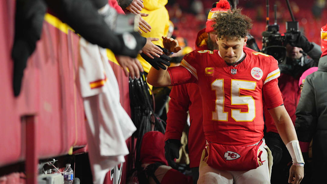 Jan 18, 2025; Kansas City, Missouri, USA; Kansas City Chiefs quarterback Patrick Mahomes (15) shakes hands with fans after defeating the Houston Texans in a 2025 AFC divisional round game at GEHA Field at Arrowhead Stadium. Mandatory Credit: Jay Biggerstaff-Imagn Images