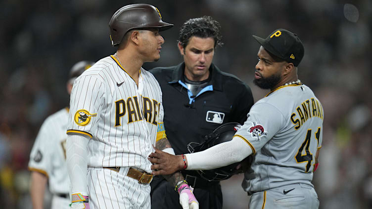 Jul 25, 2023; San Diego, California, USA; San Diego Padres third baseman Manny Machado (left) walks