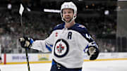 Winnipeg Jets defenseman Josh Morrissey celebrates a goal scored by right wing Nino Niederreiter against the Dallas Stars.