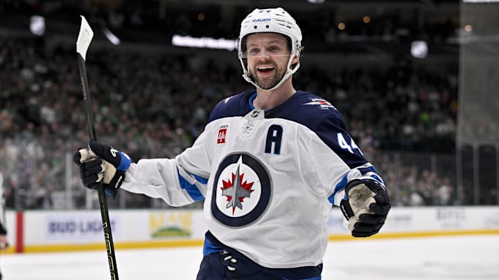Winnipeg Jets defenseman Josh Morrissey celebrates a goal scored by right wing Nino Niederreiter against the Dallas Stars.