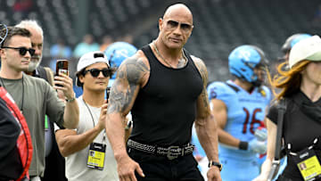 UFL owner Dwayne Johnson aka The Rock walks off the field before the game between the Arlington Renegades and the Birmingham Stallions at Choctaw Stadium. 