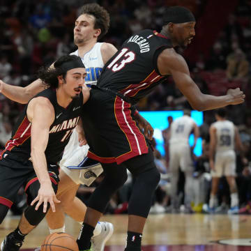 Feb 6, 2024; Miami, Florida, USA;  Miami Heat center Bam Adebayo (13) sets a screen on Orlando Magic forward Franz Wagner (22) as guard Jaime Jaquez Jr. (11) drives to the basket during the first half at Kaseya Center. Mandatory Credit: Jim Rassol-USA TODAY Sports