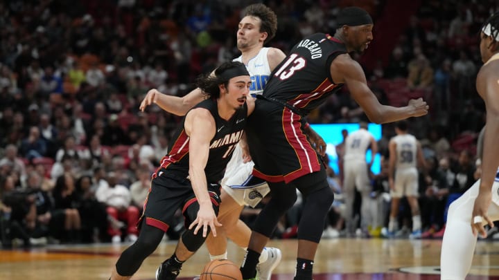 Feb 6, 2024; Miami, Florida, USA;  Miami Heat center Bam Adebayo (13) sets a screen on Orlando Magic forward Franz Wagner (22) as guard Jaime Jaquez Jr. (11) drives to the basket during the first half at Kaseya Center. Mandatory Credit: Jim Rassol-USA TODAY Sports