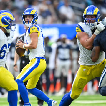 Aug 11, 2024; Inglewood, California, USA; Los Angeles Rams quarterback Stetson Bennett (13) looks to pass against the Dallas Cowboys during the fourth quarter at SoFi Stadium. Mandatory Credit: Jonathan Hui-USA TODAY Sports