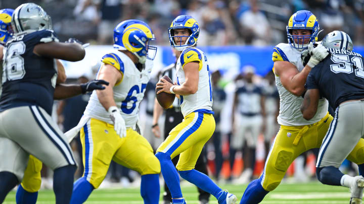 Aug 11, 2024; Inglewood, California, USA; Los Angeles Rams quarterback Stetson Bennett (13) looks to pass against the Dallas Cowboys during the fourth quarter at SoFi Stadium. Mandatory Credit: Jonathan Hui-USA TODAY Sports