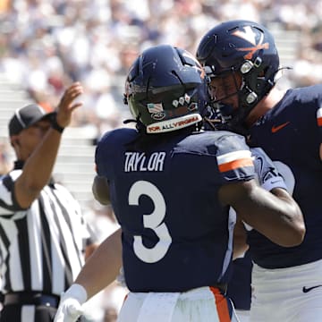 Sep 13, 2025; Charlottesville, Virginia, USA; Virginia Cavaliers running back J'Mari Taylor (3) celebrates with teammates after scoring a during the first half against the William & Mary Tribe at Scott Stadium. Mandatory Credit: Amber Searls-Imagn Images
