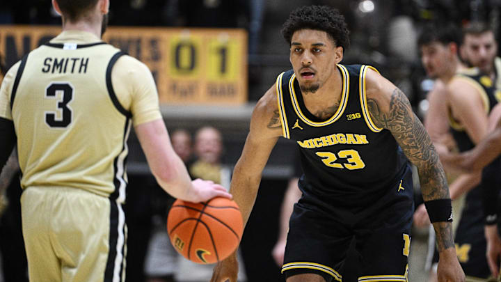 Michigan Wolverines forward Yaxel Lendeborg (23) defends against Purdue Boilermakers guard Braden Smith (3)