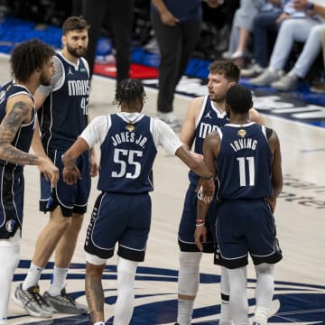 Jun 14, 2024; Dallas, Texas, USA; Dallas Mavericks center Dereck Lively II (2) and forward Maxi Kleber (42) and forward Derrick Jones Jr. (55) and guard Luka Doncic (77) and guard Kyrie Irving (11) celebrate during the game between the Dallas Mavericks and the Boston Celtics in game four of the 2024 NBA Finals at American Airlines Center. Mandatory Credit: Jerome Miron-USA TODAY Sports