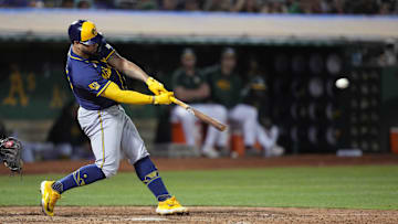 Aug 23, 2024; Oakland, California, USA; Milwaukee Brewers designated hitter Gary Sanchez (99) hits an RBI triple against the Oakland Athletics during the ninth inning at Oakland-Alameda County Coliseum. Mandatory Credit: Darren Yamashita-Imagn Images