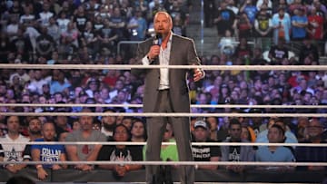 Apr 3, 2022; Arlington, TX, USA; WWE COO Triple H enters the arena and addresses fans during WrestleMania at AT&T Stadium. Mandatory Credit: Joe Camporeale-Imagn Images