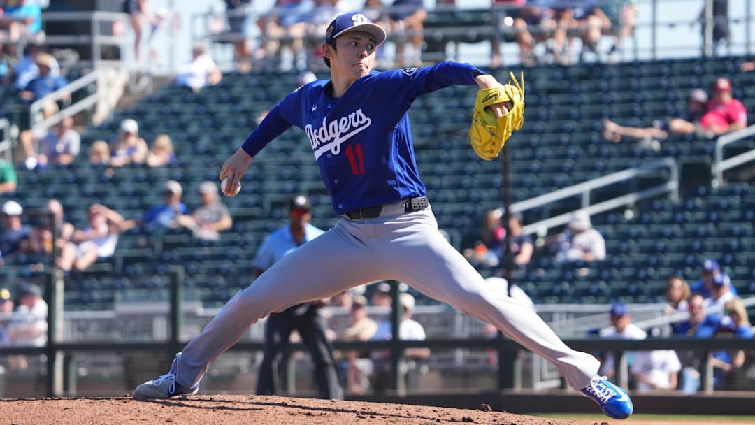Mar 3, 2026; Goodyear, Arizona, USA; Los Angeles Dodgers starting pitcher Roki Sasaki (11) pitches against the Cleveland Guardians during the second inning at Goodyear Ballpark. Mandatory Credit: Joe Camporeale-Imagn Images