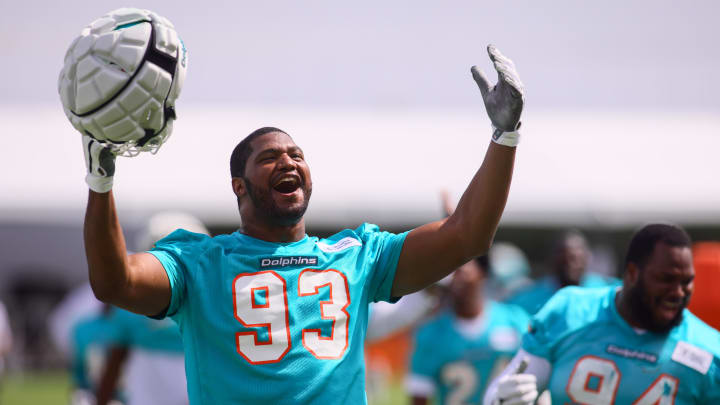 Jul 28, 2024; Miami Gardens, FL, USA; Miami Dolphins defensive tackle Calais Campbell (93) reacts toward the fans during training camp at Baptist Health Training Complex.