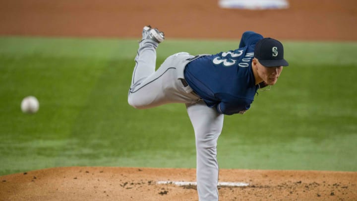 Seattle Mariners starting pitcher Bryan Woo pitches against the Texas Rangers in 2023 at Globe Life Field.