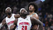 Dec 3, 2025; Milwaukee, Wisconsin, USA; Detroit Pistons forward Isaiah Stewart (28) and Milwaukee Bucks center Jericho Sims (00) box out for a free throw attempt in the first half at Fiserv Forum. Mandatory Credit: Michael McLoone-Imagn Images
