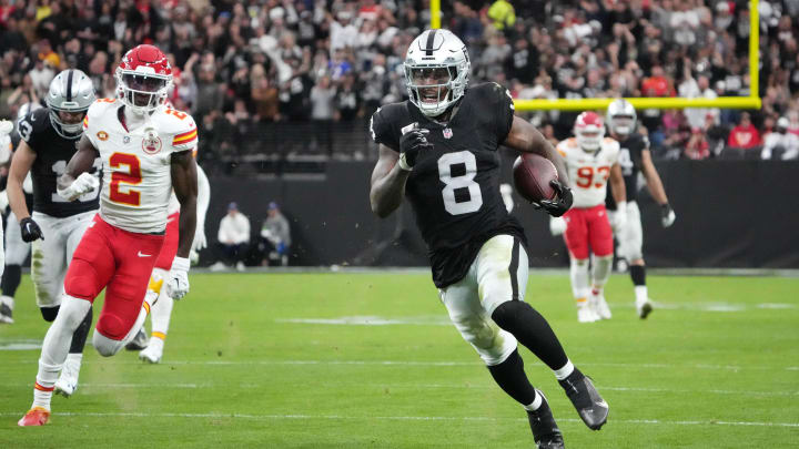 Nov 26, 2023; Paradise, Nevada, USA; Las Vegas Raiders running back Josh Jacobs (8) is pursued by Kansas City Chiefs cornerback Joshua Williams (2) on a 63-yard touchdown run in the first half at Allegiant Stadium. Mandatory Credit: Kirby Lee-USA TODAY Sports