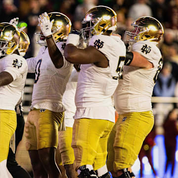 Notre Dame Fighting Irish running back Jeremiyah Love (4) and teammates.
