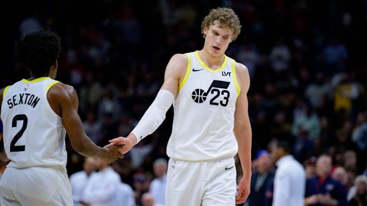 Dec 28, 2023; New Orleans, Louisiana, USA; Utah Jazz forward Lauri Markkanen (23) celebrates with Utah Jazz guard Collin Sexton (2) against the New Orleans Pelicans at the Smoothie King Center. Mandatory Credit: Matthew Hinton-Imagn Images