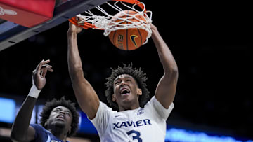 Jan 14, 2025; Cincinnati, Ohio, USA;  Xavier Musketeers guard Dailyn Swain (3) dunks the ball against Villanova Wildcats forward Enoch Boakye (13) in the first half at the Cintas Center. Mandatory Credit: Aaron Doster-Imagn Images