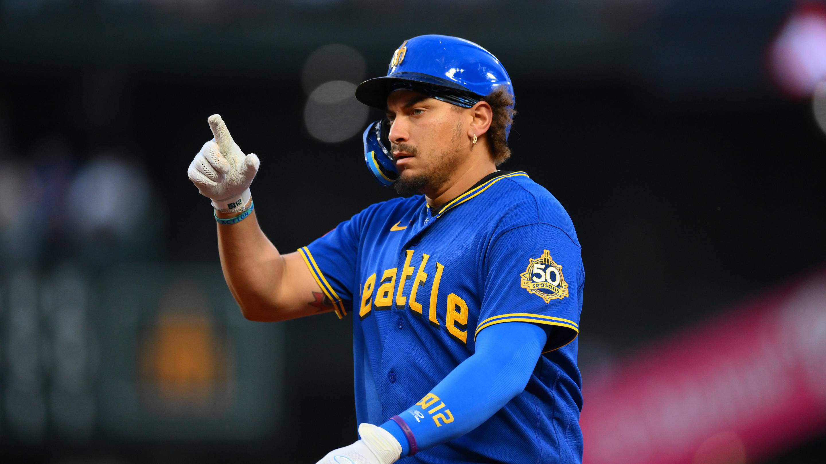 May 1, 2026; Seattle, Washington, USA; Seattle Mariners first baseman Josh Naylor (12) reacts to hitting a single against the Kansas City Royals during the fourth inning at T-Mobile Park. Mandatory Credit: Steven Bisig-Imagn Images