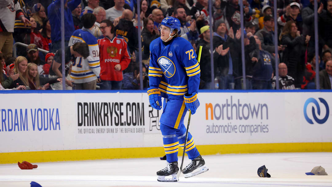 Fans throw hats on the ice to celebrate a hat trick by Buffalo Sabres right wing Tage Thompson (72): Timothy T. Ludwig-Imagn Images
