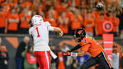 Sep 26, 2025; Corvallis, Oregon, USA; Houston Cougars quarterback Conner Weigman (1) throws a pass under pressure from Oregon State Beavers linebacker Aiden Sullivan (2) during the first quarter at Reser Stadium. Mandatory Credit: Craig Strobeck-Imagn Images