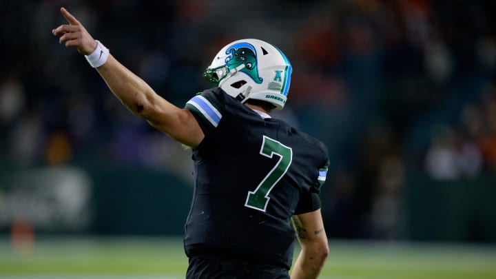 Nov 24, 2023; New Orleans, Louisiana, USA; Tulane Green Wave quarterback Michael Pratt (7) points to the scoreboard after a touchdown against the UTSA Roadrunners during the second half at Yulman Stadium.