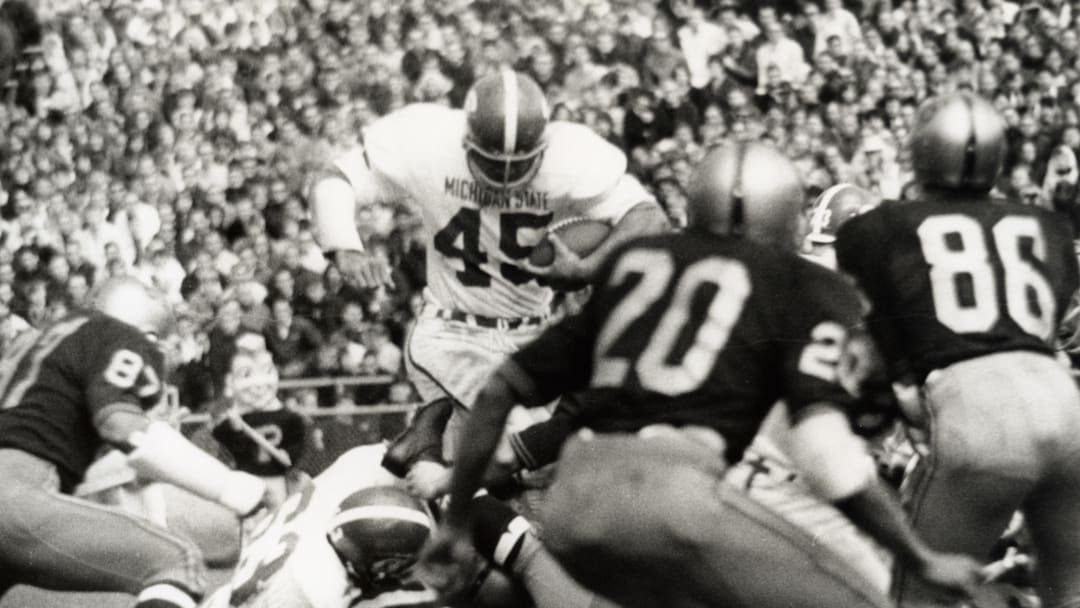Oct 22, 1966; East Lansing, MI, USA: FILE PHOTO; Michigan State Spartans running back Robert Apisa (45) runs with the ball against the Purdue Boilermakers . The Spartans beat the Boilermakers 41-20. Mandatory Credit: Malcolm Emmons- Imagn Images