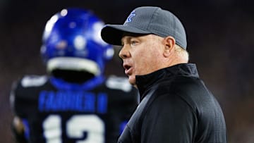 Oct 12, 2024; Lexington, Kentucky, USA; Kentucky Wildcats head coach Mark Stoops talks to a referee during the first quarter against the Vanderbilt Commodores at Kroger Field. Mandatory Credit: Jordan Prather-Imagn Images