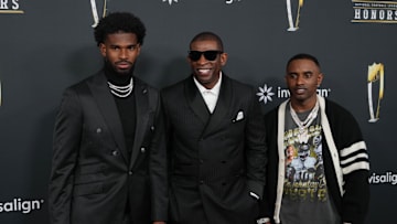 Feb 6, 2025; New Orleans, LA, USA;  Deion Sanders with his sons Shedeur Sanders (left) and Deion Sanders Jr. (right) on the red carpet before Super Bowl LIX NFL Honors at Saenger Theatre. Mandatory Credit: Kirby Lee-Imagn Images