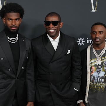 Feb 6, 2025; New Orleans, LA, USA;  Deion Sanders with his sons Shedeur Sanders (left) and Deion Sanders Jr. (right) on the red carpet before Super Bowl LIX NFL Honors at Saenger Theatre. 