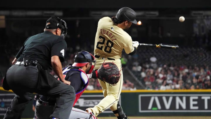 Jul 30, 2024; Phoenix, Arizona, USA; Arizona Diamondbacks third base Eugenio Suárez (28) hits a two run home run against the Washington Nationals during the first inning at Chase Field. Mandatory Credit: Joe Camporeale-USA TODAY Sports