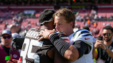 Cleveland Browns defensive end Myles Garrett (95) and Cincinnati Bengals quarterback Joe Burrow (9) hug after the fourth quarter of the NFL Week 1 game between the Cleveland Browns and the Cincinnati Bengals at Huntington Bank Field in Cleveland on Sunday, Sept. 7, 2025. The Bengals begin the season with a 17-16 win over the Browns.