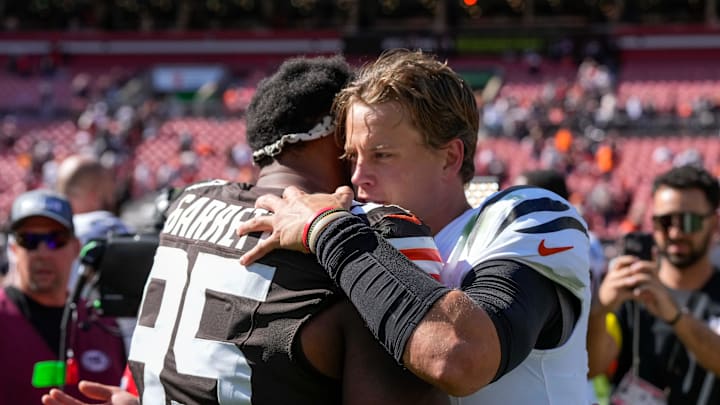 Cleveland Browns defensive end Myles Garrett (95) and Cincinnati Bengals quarterback Joe Burrow (9) hug after the fourth quarter of the NFL Week 1 game between the Cleveland Browns and the Cincinnati Bengals at Huntington Bank Field in Cleveland on Sunday, Sept. 7, 2025. The Bengals begin the season with a 17-16 win over the Browns.