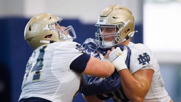 Notre Dame offensive linemen Ashton Craig, right, and Joe Otting participate in a drill during a Notre Dame football practice at Irish Athletic Center on Thursday, Aug. 15, 2024, in South Bend.