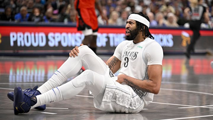 Feb 8, 2025; Dallas, Texas, USA; Dallas Mavericks forward Anthony Davis (3) falls to the court during the second quarter against the Houston Rockets at American Airlines Center. Mandatory Credit: Jerome Miron-Imagn Images