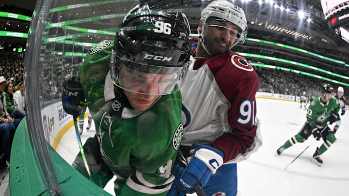Apr 4, 2026; Dallas, Texas, USA; Colorado Avalanche center Nazem Kadri (91) checks Dallas Stars right wing Mikko Rantanen (96) during the second period at the American Airlines Center. Mandatory Credit: Jerome Miron-Imagn Images