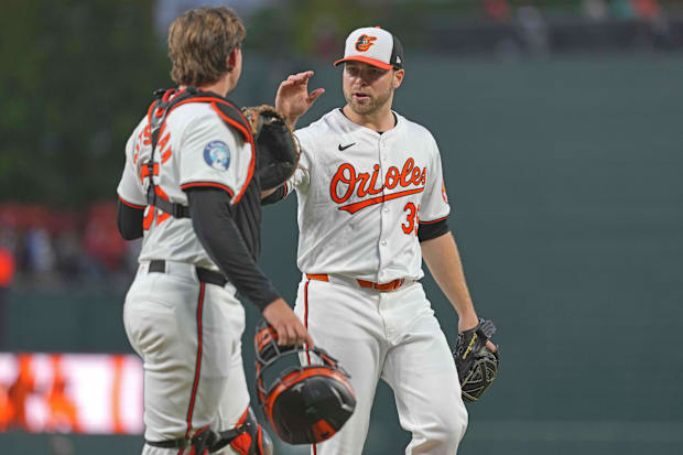 Aug 22, 2024; Baltimore, Maryland, USA; Orioles' Corbin Burnes greeted by catcher Adley Rutschman.