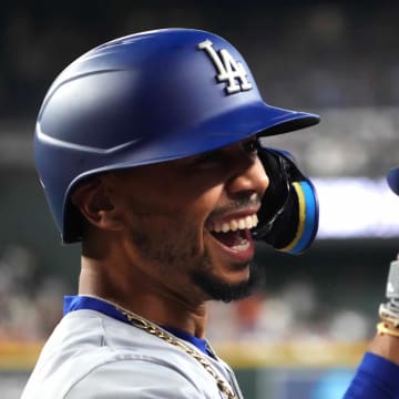 Los Angeles Dodgers shortstop Mookie Betts (50) celebrates after hitting a solo home run against the Arizona Diamondbacks during the first inning at Chase Field on Aug 31.